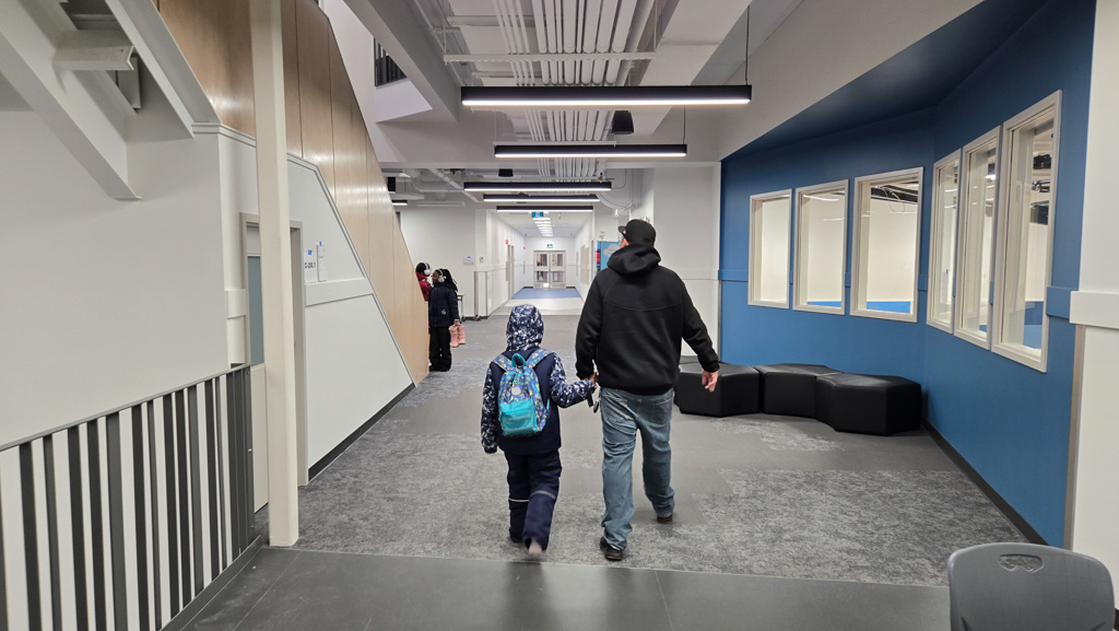 A father and daughter arrive at St Raphael on opening day